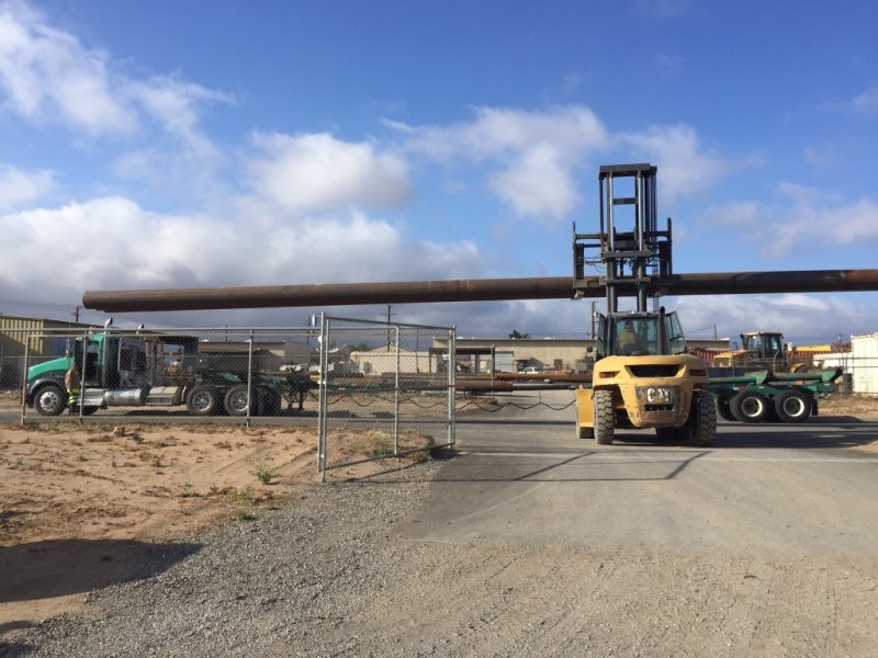 Side view of Big Bear pipes above the fence